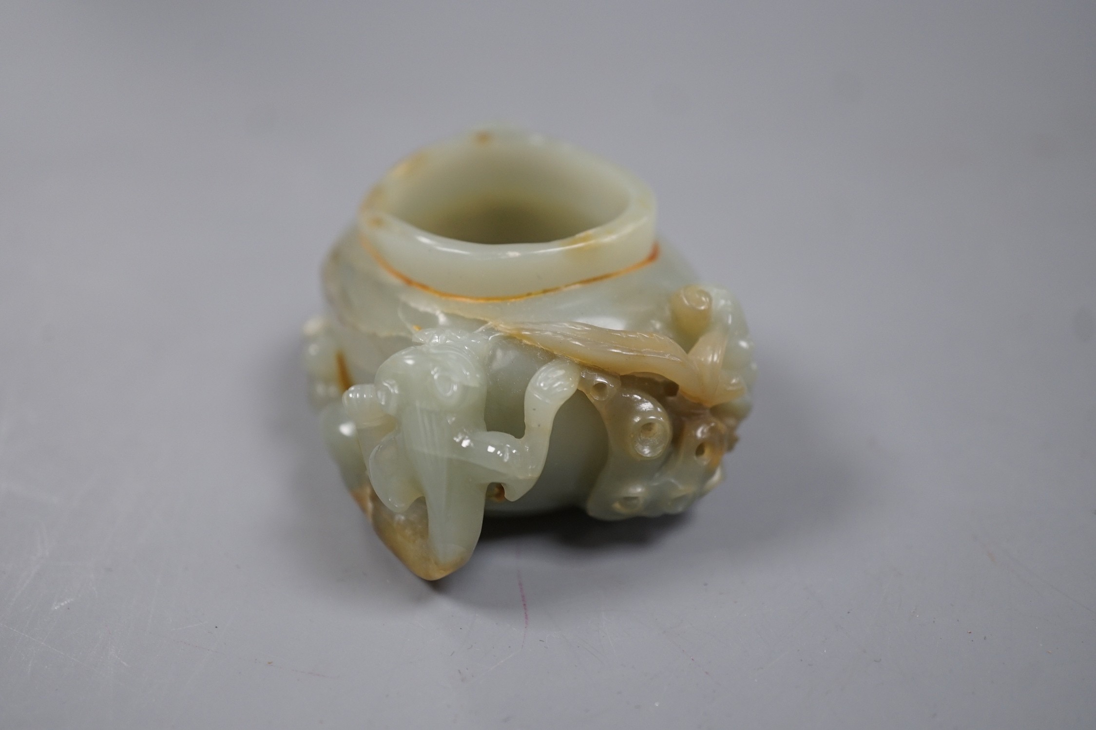 A Chinese celadon jade brushwasher, dragons